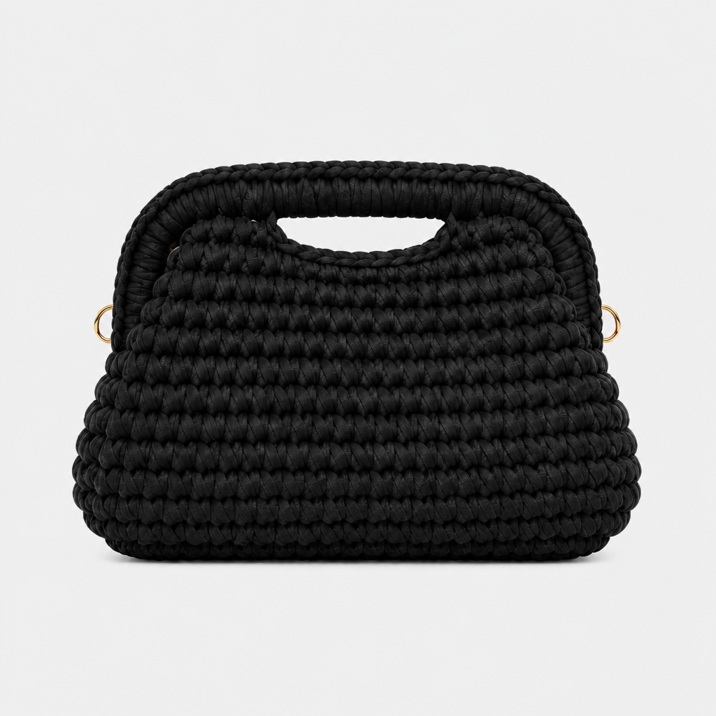 Borsa clutch intrecciata nero su sfondo pieno grigio chiaro